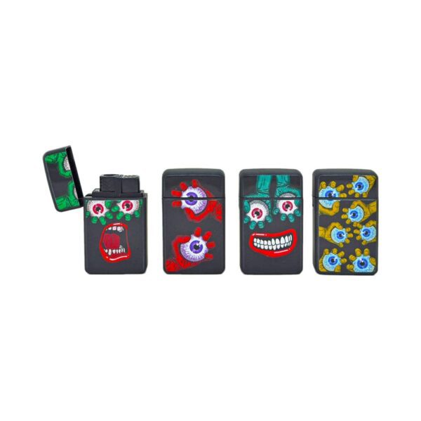 FOX Flip Cover Jet Flame Lighters – Smile Series – windproof pop-art lighters with surreal eye and mouth designs on matte black body.