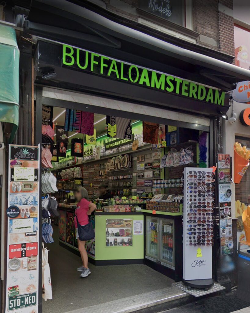 Tourist shop in Amsterdam selling cannabis lollipops, CBD edibles, and souvenirs.