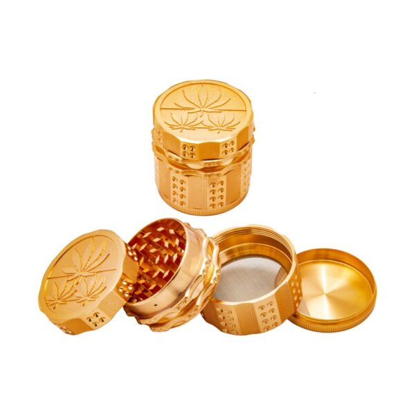 Opened rose gold metal herb grinder showing diamond-shaped teeth and pollen catcher