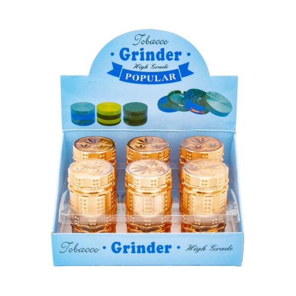 Display of 12 rose gold metal herb grinders with diamond teeth and cannabis leaf design