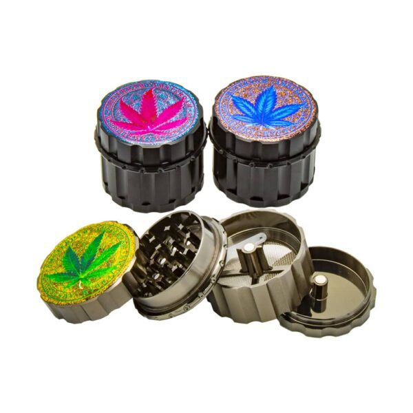 Close-up of black 4-part metal herb grinders with colorful glitter cannabis leaf lids and mesh screen pollen catcher