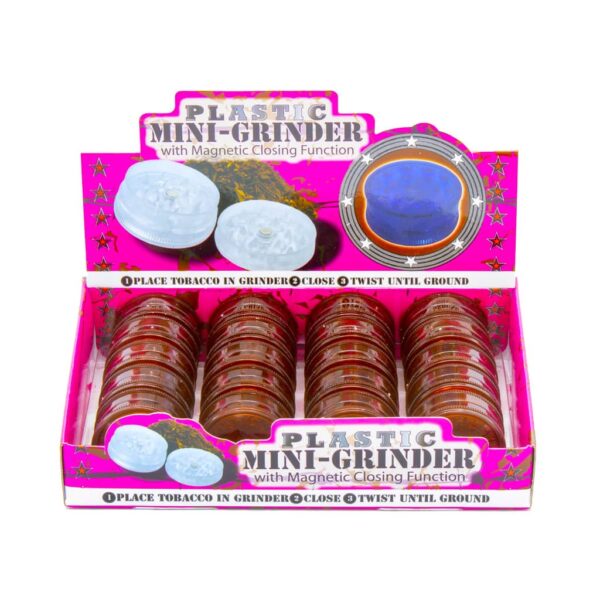 Display of 20 copper-colored plastic herb grinders with shark teeth and magnetic lid, for wholesale smoking accessories
