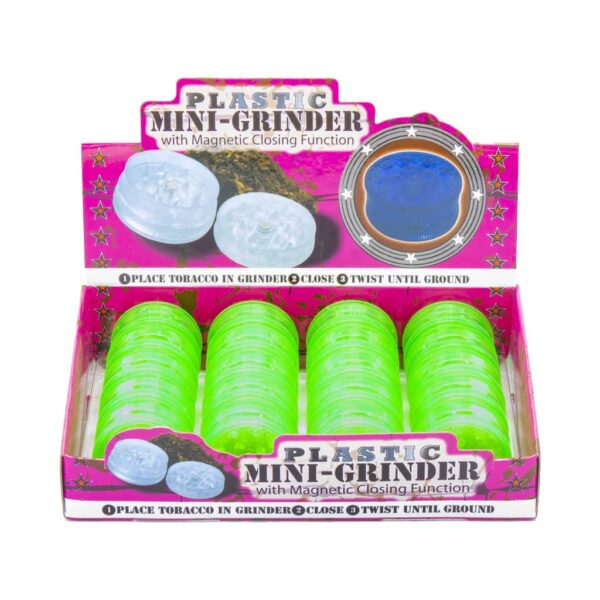 Display of 20 green plastic herb grinders with shark teeth and magnetic lid, 2-part design for wholesale use