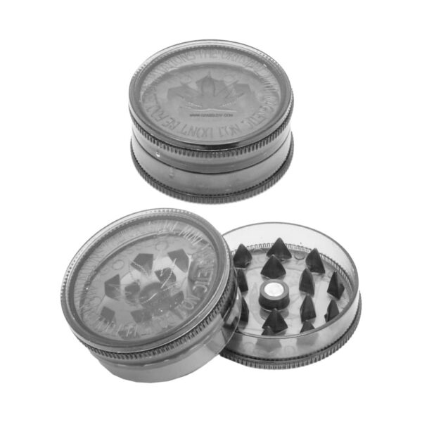 Black plastic herb grinder with shark teeth, magnetic closure, and cannabis leaf design, shown open and closed