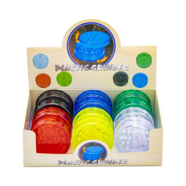 Display of 12 colorful plastic herb grinders with stash storage compartment, 2-part design with shark teeth