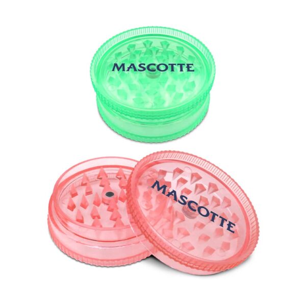 Plastic herb grinders in green and pink with shark tooth design and Mascotte logo