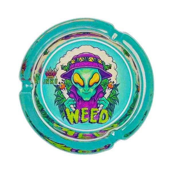 Round turquoise glass ashtray featuring a green alien smoking design with “WEED” text, ideal for home or outdoor use.
