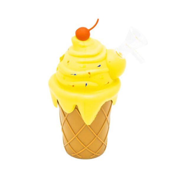 Silicone bong shaped like an ice cream cone with yellow frosting, colorful sprinkles, red cherry topper, and clear glass bowl, displayed on a white background.