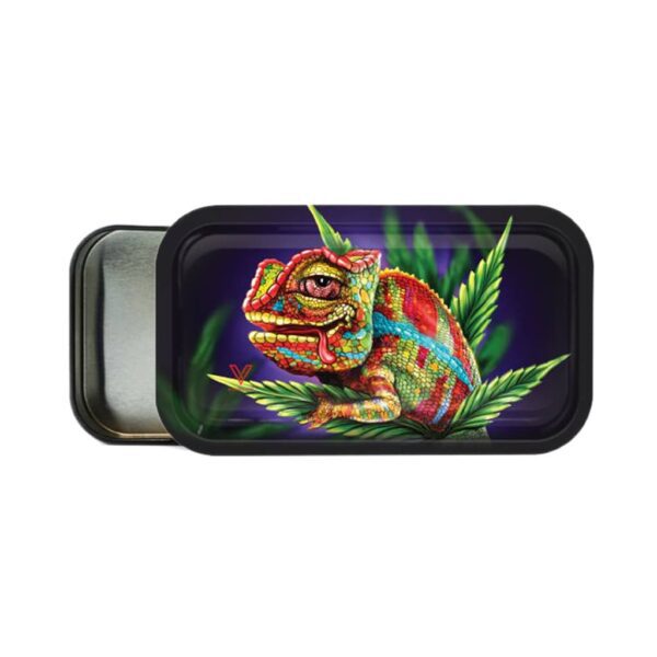 Metal rolling tray with a colorful chameleon illustration and magnetic lid, surrounded by green leaves on a dark background.
