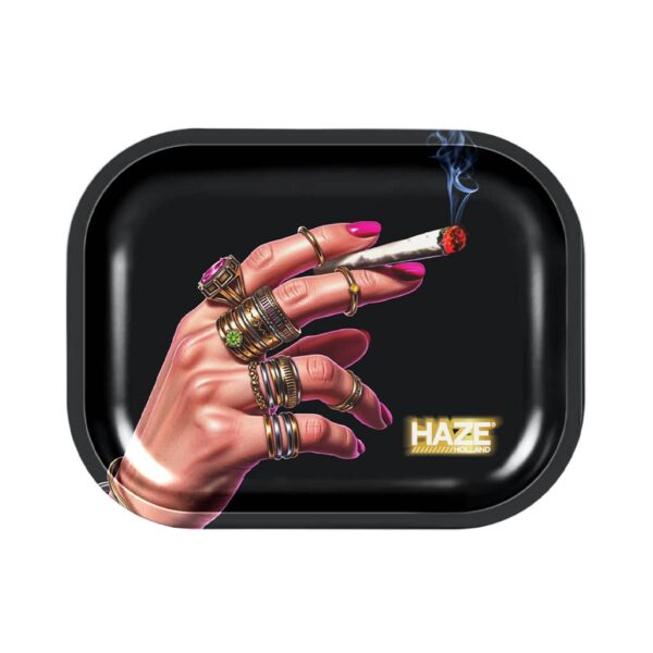 Small rolling tray with a jeweled hand holding a lit joint on a black background.