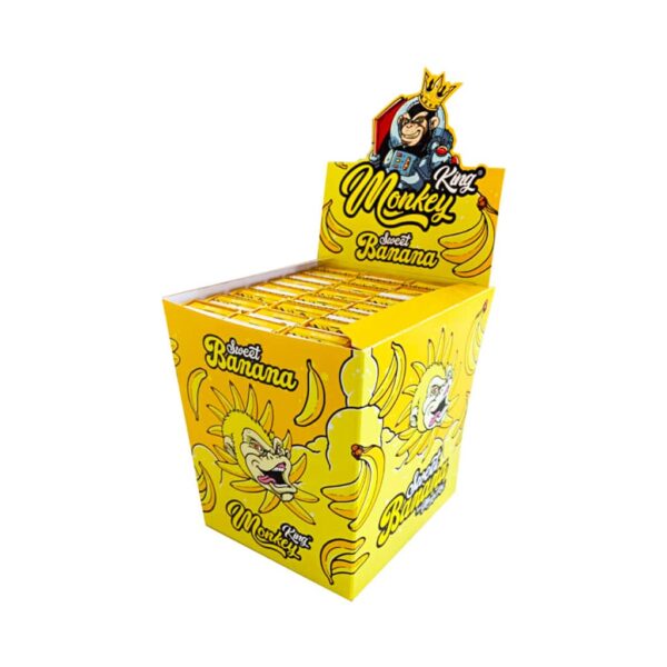 Monkey King Sweet Banana king size slim rolling papers display box with 24 packs, decorated with yellow banana artwork.