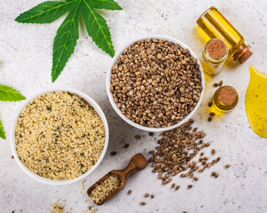 Hemp seeds, hemp hearts, and hemp seed oil on a table